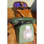 A cased pair of Komandatur field glasses, together with a retro green dial telephone.