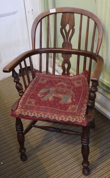 A 19th century stick and slat back country armchair.