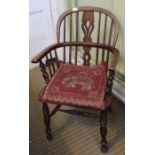 A 19th century stick and slat back country armchair.