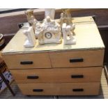 A mid-century two over two chest of drawers, with glass top and mirrored back