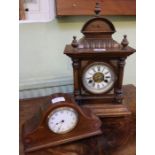 An early 20th century probably German architectural soft wood mantel clock plus one other.