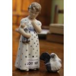 A Royal Copenhagen ceramic figure of a little girl with a small model dove.