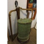 Circular pad top foot stool with a lidded woven basket, two walking sticks and a gilt framed plain .