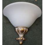 A set of four wall lights with opaque half moon shades.