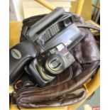 A leather case camera and an old phone