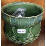 An Art Nouveau green glazed planter containing domestic metalwares, many items silver