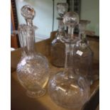 A large pair of 19th century decanters with stoppers, two globe & shaft decanters and a claret jug