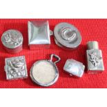 A bag containing small silver containers.