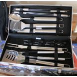 A cased and new BBQ utensil set.