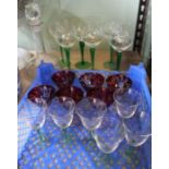 Three sets of six small bowl stemmed glasses with a thumb cut decanter and stopper.