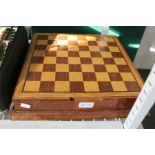 A chess board and box containing a quality cast metal Armada chess set