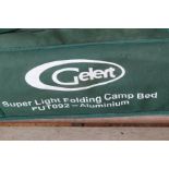 A pair of "Gelert" folding aluminum camp beds.