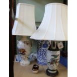 A blue & white pottery stick stand, and two table lamps with shades