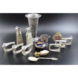 A filigree silver vase, various scent bottles, mouse on cheese napkin rings, etc.