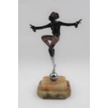 An Art Deco figure, profile cut chrome dancer, balanced upon a ball, raised on a stepped Alabaster b