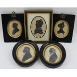 A collection of five Silhouettes, one of a lady with gilded highlights, all framed.