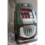 A late 1960's cast metal Mills branded 'Watermelon' token operated Fruit Machine, standing 68cm high