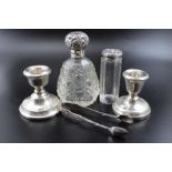 Two small silver candlesticks and assorted other silver wares.