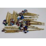 A collection of thirty bone lace bobbins, some with coloured and spot decoration, some with wire ba