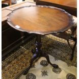 A mahogany snap top, pie crust rim tripod table, 59 cm diameter