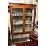 An Edwardian mahogany and satinwood inlaid two door display cabinet. 166 x 96 cm.