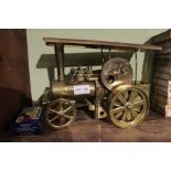 A Wilesco brass finished live steam traction engine