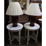 A pair of later painted circular topped side tables with reeded legs, with a pair of lamps.