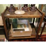 An oak two tier dinner wagon with cutlery drawer