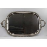 A two-handled Old Sheffield plate tea tray, floral cast handles, gadrooned rim, 72cm x 42cm (includi