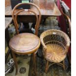 A woven wicker child's tub chair with a bentwood cafe chair with later seat