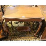 An Edwardian mahogany fold over card table, serpentine front, with undertier, 70cm wide