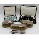 A pair of silver sugar tongs, together with a cased set of six silver coffee spoons,