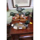 A pair of painted wooden duck bookends, together with a duck telephone & doorstop duck