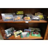 Two shelves of boxed various motor vehicles.