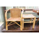 A child's rattan chair and stool