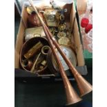 A box containing a selection of brassware various, to include horse brasses
