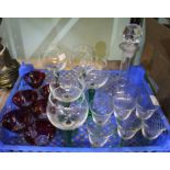 Three sets of six small bowl stemmed glasses with a thumb cut decanter and stopper.