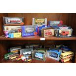 Two shelves of various boxed motor vehicles.