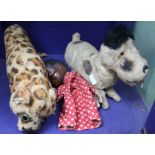 A mid 20th century clockwork child's toy dog and a stuffed leopard and a doll hand puppet.