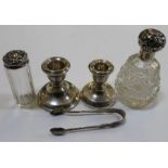 Two small silver candlesticks and assorted other silver wares.