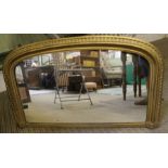 A large gilt framed over mantle mirror.