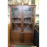 A well built mahogany display case, fancy glaze.