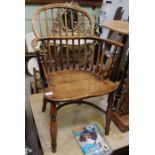 A small proportioned 19th century double comb back armchair.