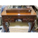 A reproduction mahogany three drawer Lowboy on cabriole legs.