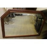 A Large modern carved over mantle mirror.