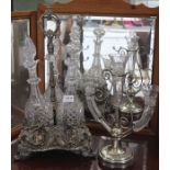 A Victorian silver plate 3 bottle decanter stand ( housing 3 stoppered decanters )