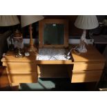 A wood effect modern dressing table, fitted drawers