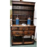 A reproduction small pot board dresser with rack