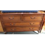 A reproduction mahogany chest of two short over two long drawers.