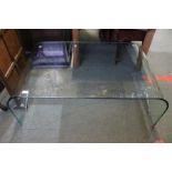 A large glass coffee table, 110cm x 40cm
